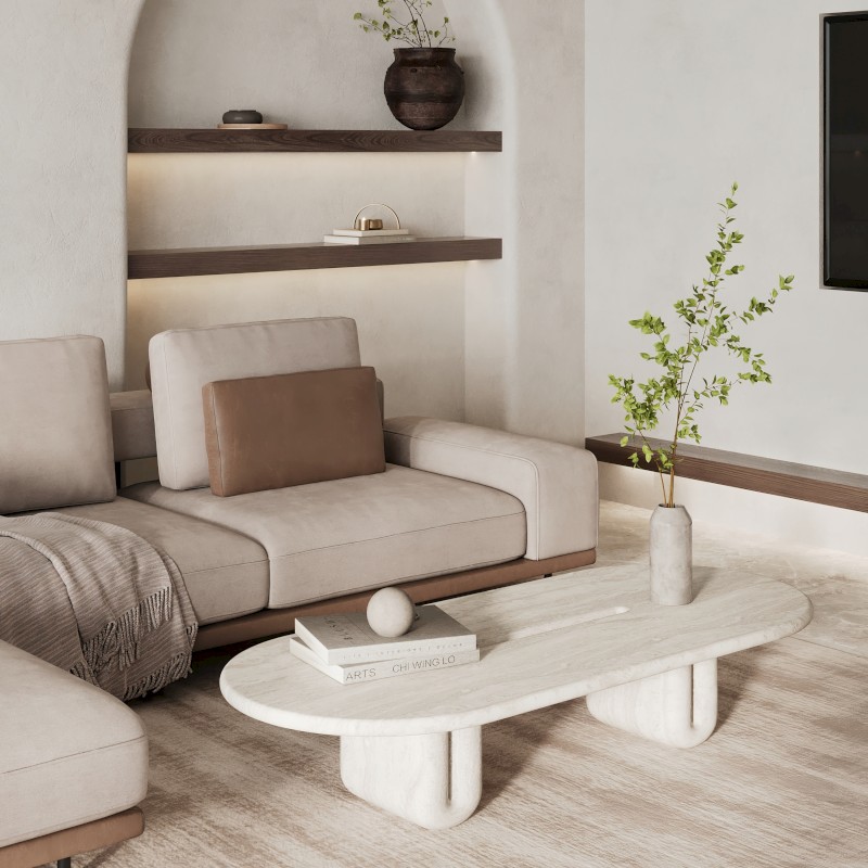 A modern living room with a light sofa, coffee table, shelves, and decorations. Neutral tones create a cozy, minimalist vibe.